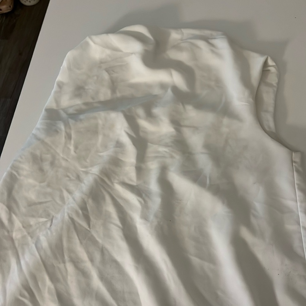 White sleeveless sheer double line blue top with buttons